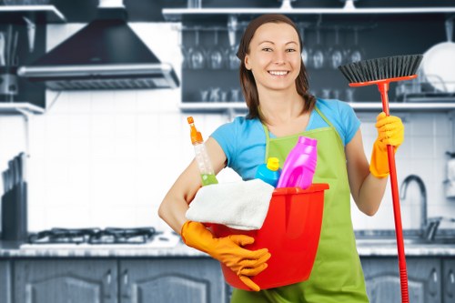 Professional oven cleaner working in a Merton home kitchen
