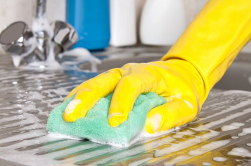 Staff applying health and safety measures in a cleaned area