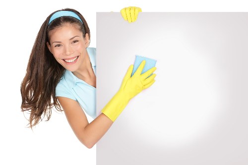 Office cleaner maintaining meeting rooms in Merton