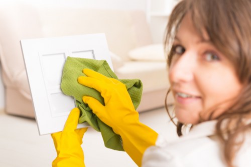 Local cleaner tidying a bathroom in a Merton property during a domestic clean